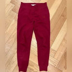 Proenza Schouler track pants in burgundy color